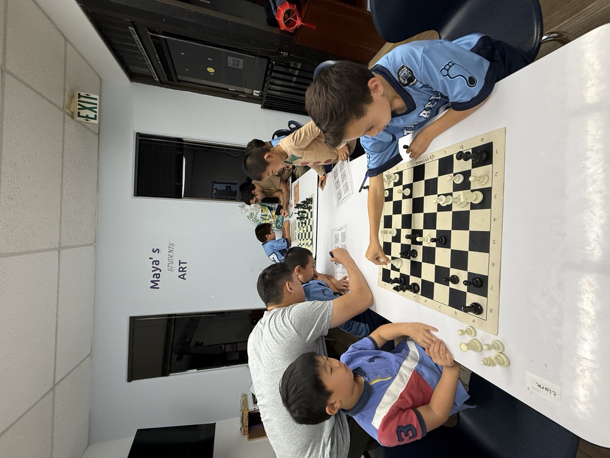 A coach working one-on-one with a student during class