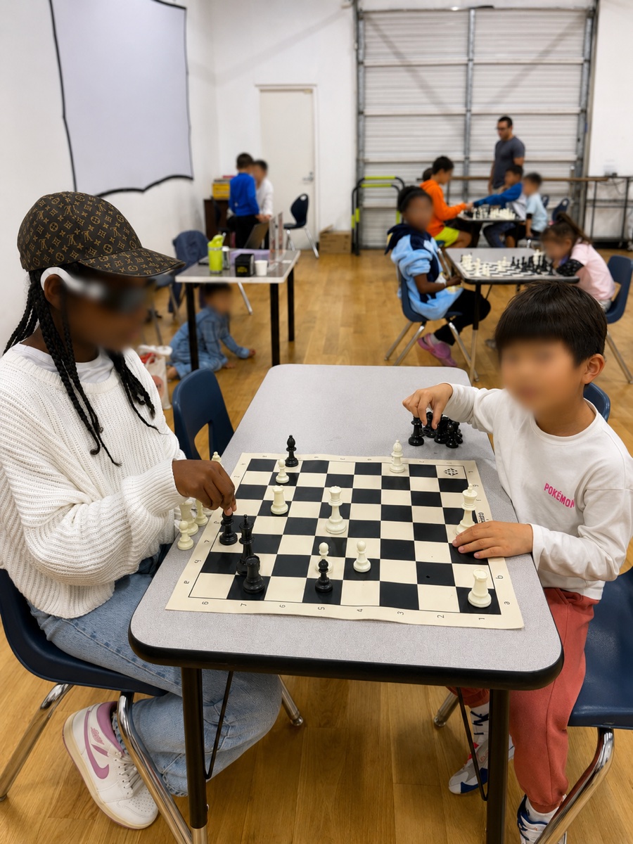 Two students playing a chess match together
